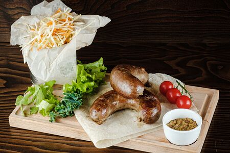 Колбаски с томатами