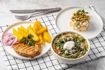 Отбивная из свинины с луком, картофель запеченный, оливье и окрошка