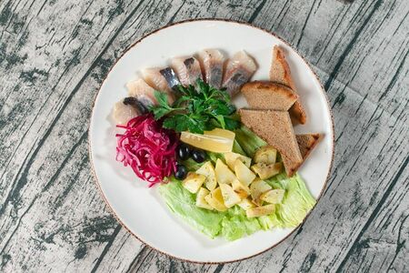 Сельдь с гарниром