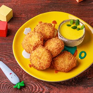 Куриные наггетсы с соусом чеддер