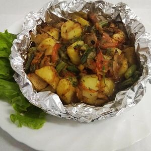 Тушёная свинина с овощами