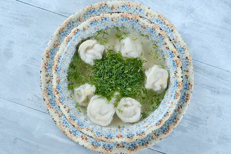 Пельмени с бульоном