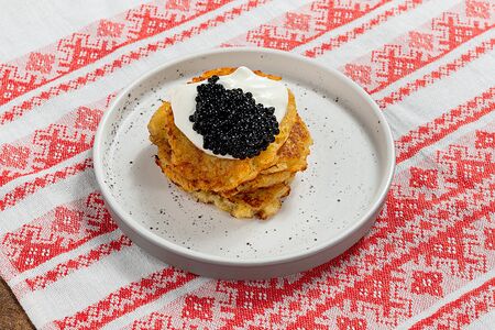 Драники с черной икрой 