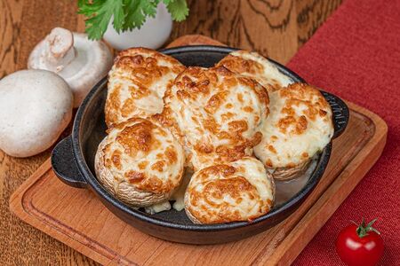 Фаршированные грибные шапочки с сыром