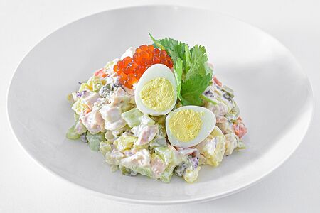 Оливье с красной икрой и курицей