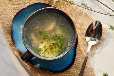 Куриный бульон с домашней лапшой и яйцом