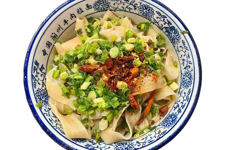 Широкая лапша в масляном соусе