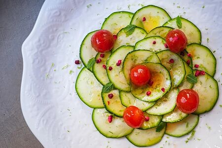 Карпаччо из кабачка с трюфельной заправкой и маринованными черри