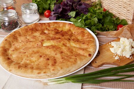 Осетинский пирог с курицей, сыром и зеленым луком
