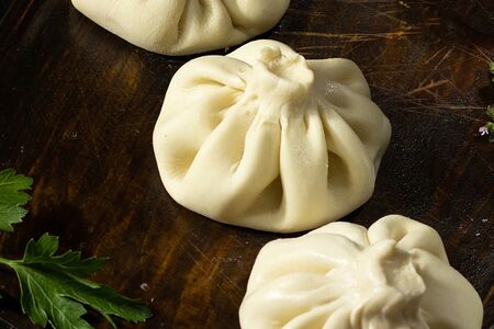 Хинкали с бараниной и чесночным соусом