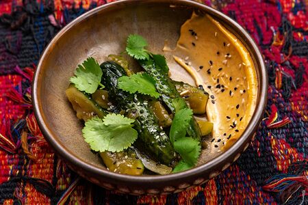 Битые огурцы с кинзой и соусом кимчи