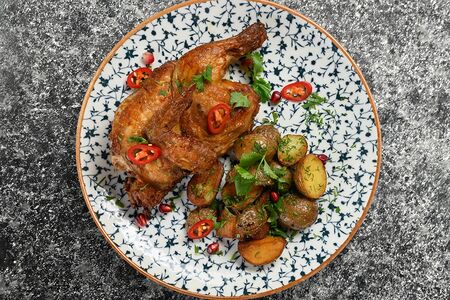 Цыпленок тапака с молодым картофелем