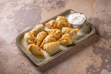 Пельмени Кюрза жареные с соусом