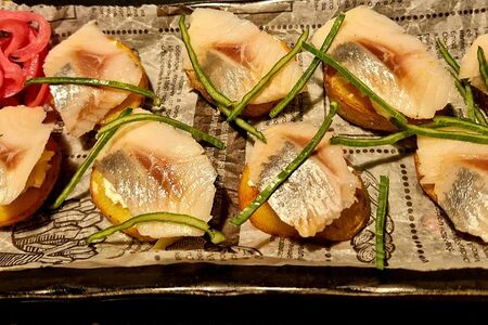 Сельдь на печеном картофеле