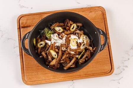 Рубец говяжий с луком жареный