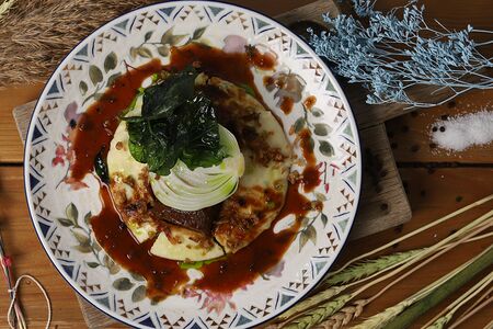 Томленые говяжьи щечки в темном пиве