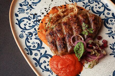 Абхазура с пюре из батата и соусом сацебели