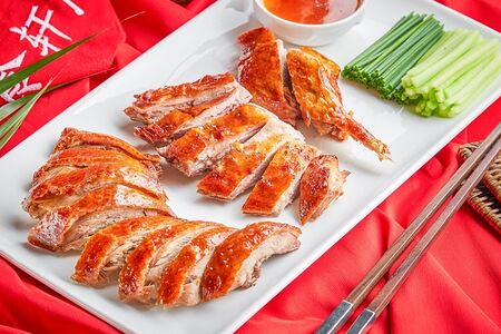 Половина запеченной утки