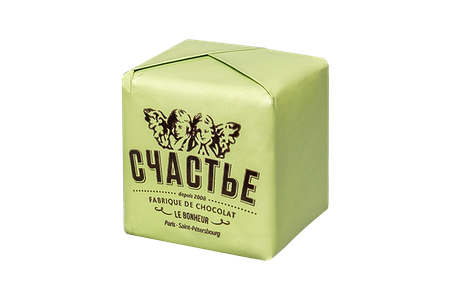 Конфета Пралине в молочном шоколаде с фисташкой и базиликом