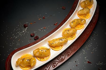 Рыбные рулетики с бананом в апельсиновом соусе