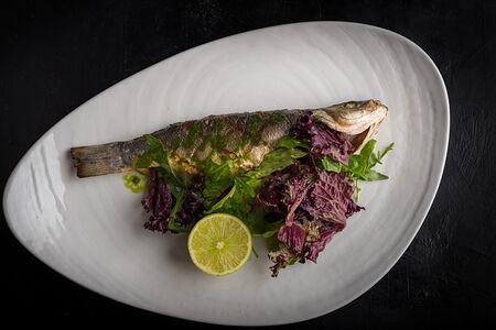 Сибас целый под соусом песто