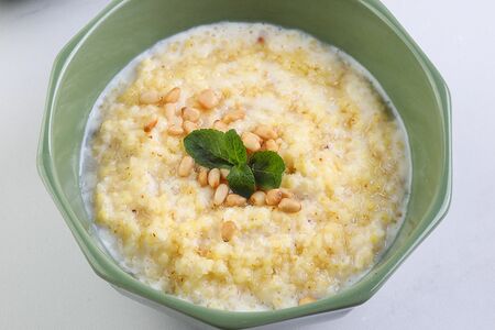 Каша пшенная с медом и кедровыми орешками