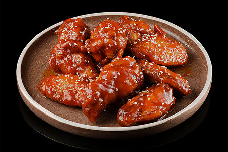 Куриные крылышки в кислосладком соусе