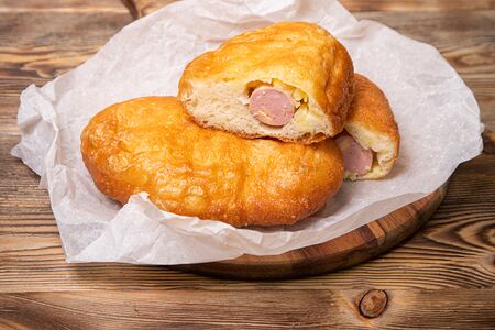 Пирожок жареный с картофелем и сосиской