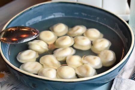 Пельмени в курином бульоне