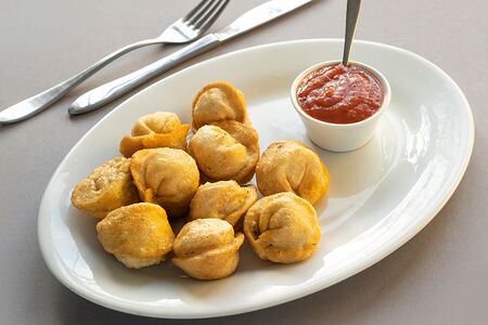 Пельмени жареные