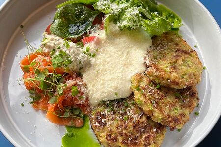 Оладьи из кабачка с форелью, томатами и муссом из пармезана