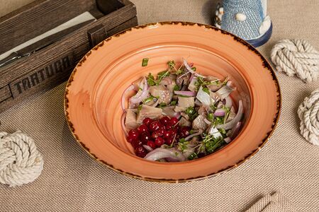 Закуска из сельди и квашеной клюквы с облепиховым уксусом