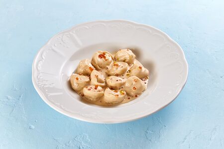 Пельмени с карельской форелью, судаком и красной икрой