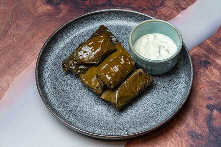 Долма с бараниной со сметанным соусом