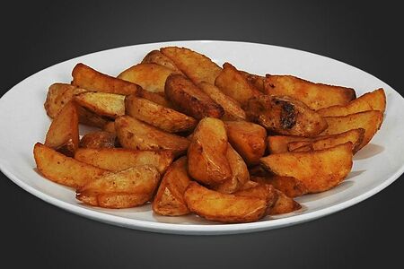 Дольки картофеля в специях, жаренные во фритюре