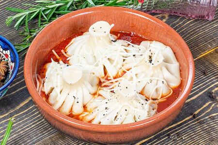 Хинкали с бараниной и томатным соусом