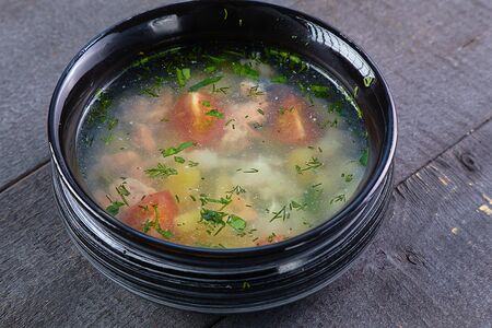 Уха с костра с двумя видами рыб