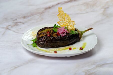 Кучмачи из куриных потрохов в баклажане