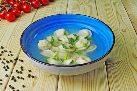 Пельмени с бульоном из телятины