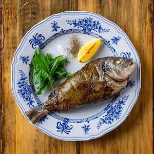 Запеченая дорада с томатами