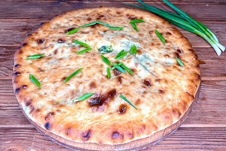 Осетинский пирог с зеленым луком и сыром