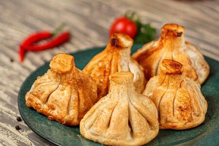 Хинкали со свининой и говядиной жареные