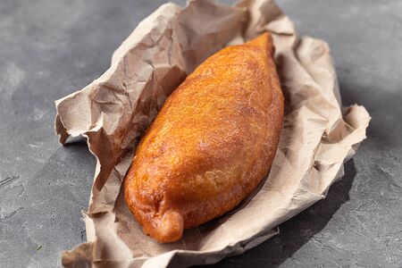 Пирожок с капустой жареный