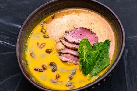 Тыквенный суп с ореховым муссом и вяленой уткой