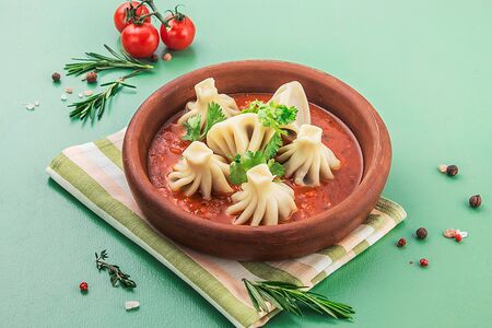 Мини-хинкали с бараниной в томатном соусе