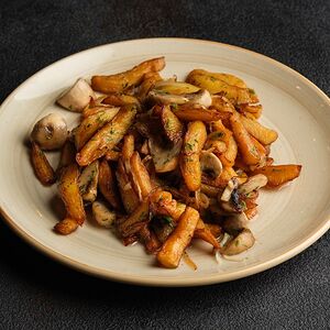 Картофель, жаренный с шампиньонами