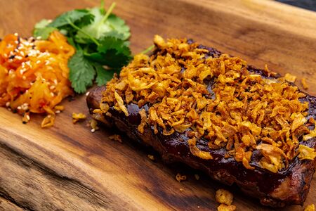 Свиные ребра BBQ c черноплодной рябиной и капустой кимчи