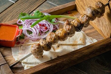 Абхазура в бараньей сетке с молодым картофелем