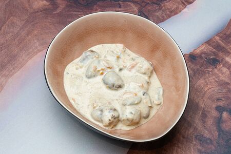 Куриные сердечки в сырном соусе