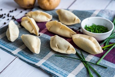 Вареники с жареным луком и укропом